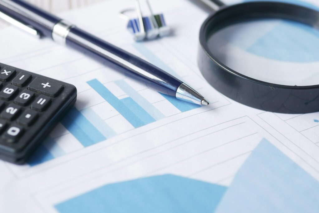 financial documents with a calculator.